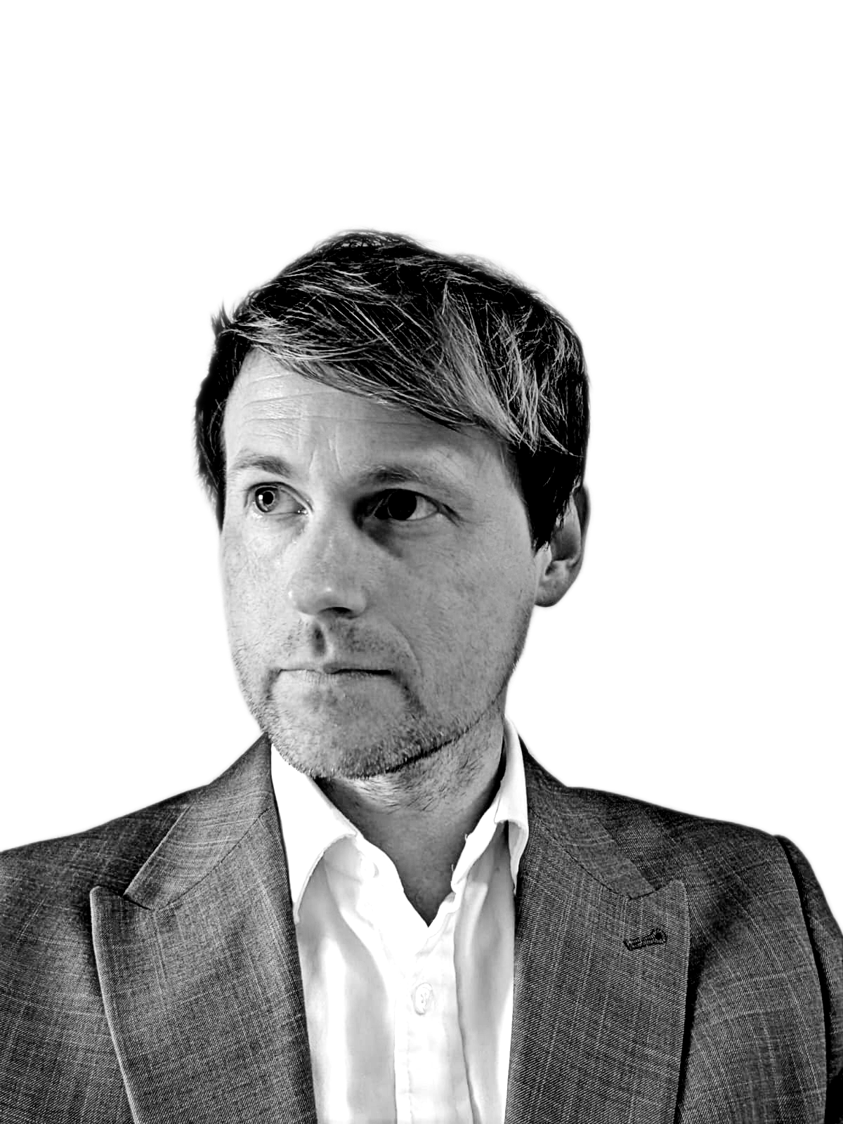 Jonathan Clarke A man wearing a grey suit and white shirt looking over to the left.